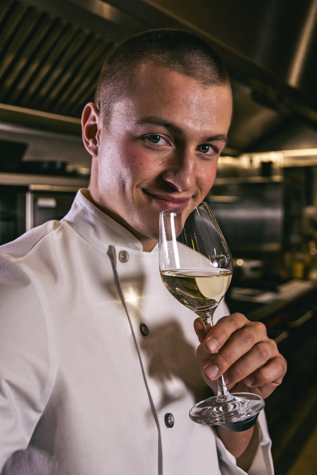 A sommelier tasting white wine
